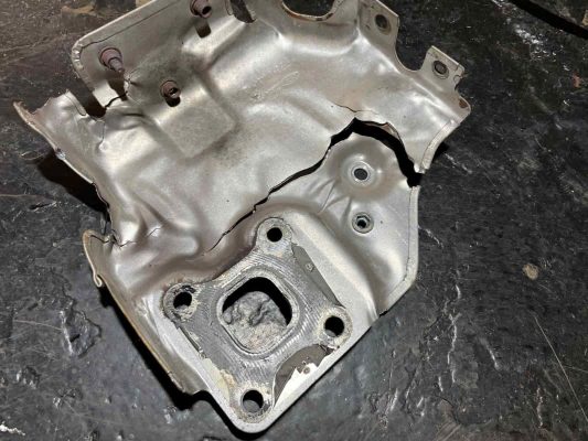 cracked exhaust cowling from a ford focus